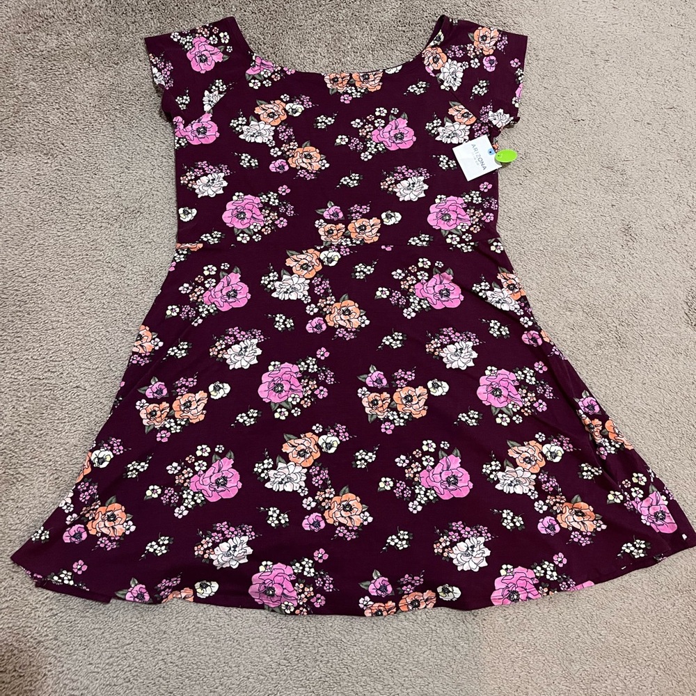This is a burgundy floral summer dress brand new with the tags still on it.